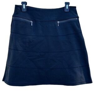 Athleta Skirt,mid length,black with two front  zipper pockets,women’s size small